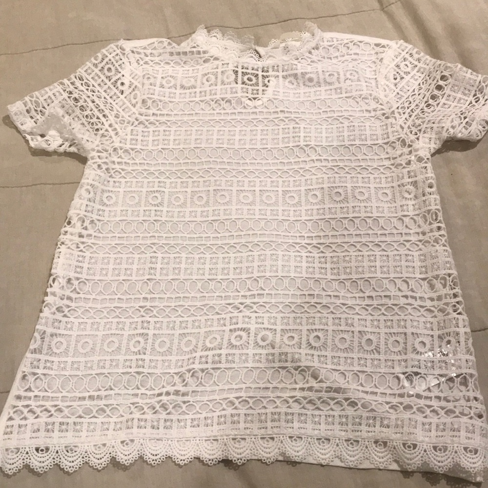 Lace top with keyhole button back.